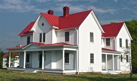 white house with red metal roof|residential white metal roof.